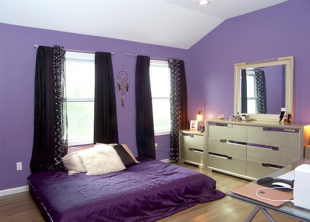8 W Narcissus Rd, Mastic Beach, NY 11951 - bedroom with wood finished floors and lofted ceiling