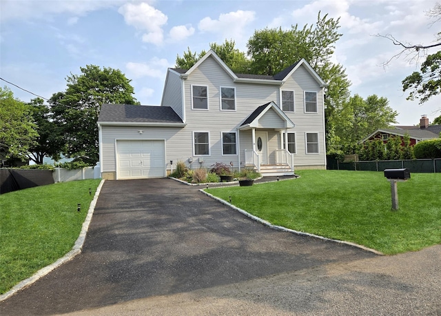 8 W Narcissus Rd, Mastic Beach, NY 11951 - view of front facade featuring an attached garage and asphalt driveway