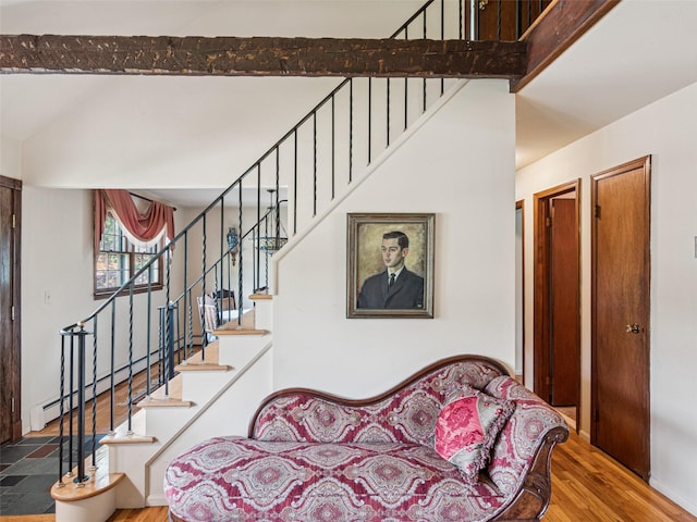347 Scudder Ave, Northport, NY 11768 - staircase featuring wood finished floors, baseboard heating, and a high ceiling