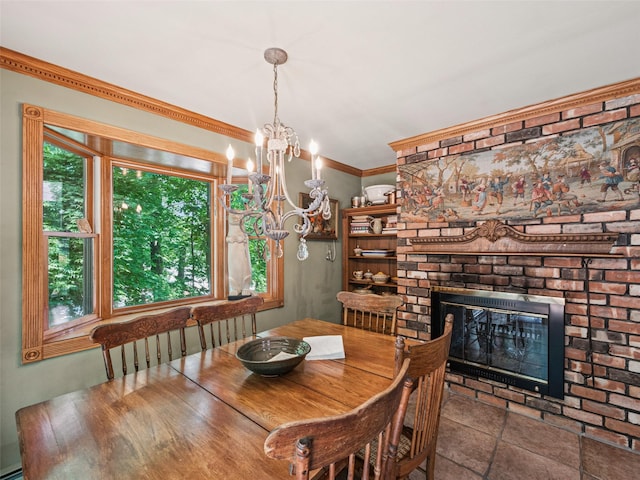 347 Scudder Ave, Northport, NY 11768 - dining space with a fireplace, a chandelier, and crown molding