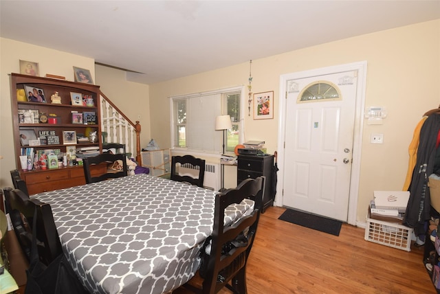 113 Edgeworth St, Valley Stream, NY 11581 - dining area featuring radiator, stairway, and wood finished floors