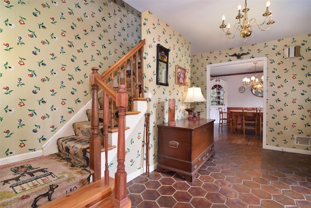 3 Little Ln, White Plains, NY 10605 - stairway with wallpapered walls, a chandelier, and tile patterned flooring