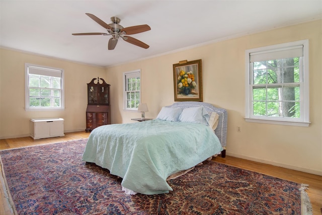 3 Little Ln, White Plains, NY 10605 - bedroom featuring multiple windows, wood finished floors, ornamental molding, and ceiling fan