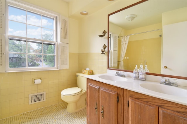 3 Little Ln, White Plains, NY 10605 - full bath featuring double vanity, tile walls, tile patterned floors, curtained shower, and a wainscoted wall