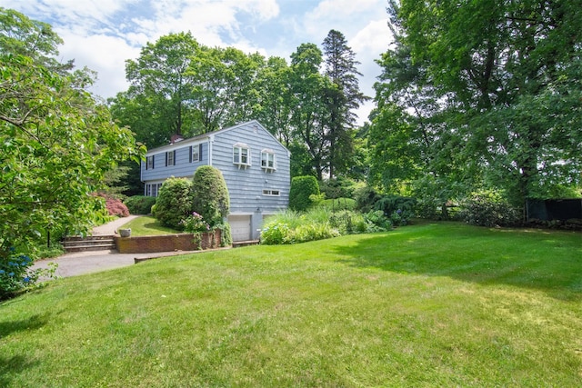 3 Little Ln, White Plains, NY 10605 - view of grassy yard with a garage and driveway