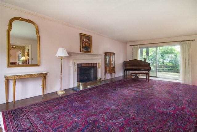 3 Little Ln, White Plains, NY 10605 - living area featuring a fireplace with raised hearth, ornamental molding, and wood finished floors