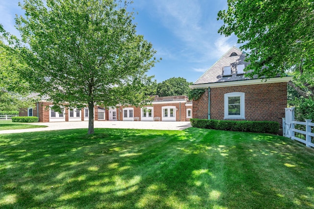 1750 Mount Beulah Ave, Southold, NY 11971 - view of front facade with french doors and brick siding