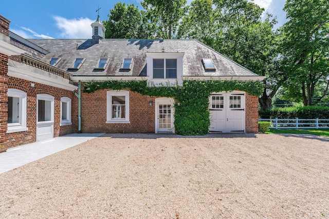 1750 Mount Beulah Ave, Southold, NY 11971 - view of front of home with a high end roof and brick siding