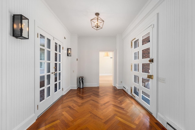 1750 Mount Beulah Ave, Southold, NY 11971 - hallway featuring crown molding, french doors, and a chandelier