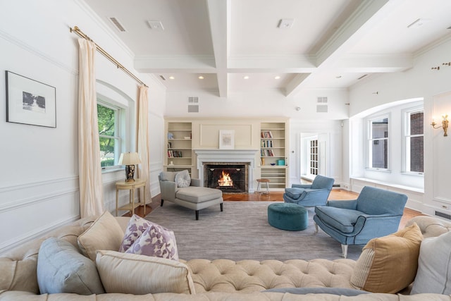 1750 Mount Beulah Ave, Southold, NY 11971 - living area featuring coffered ceiling, beam ceiling, a fireplace with flush hearth, ornamental molding, and wood finished floors