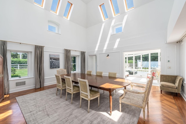 1750 Mount Beulah Ave, Southold, NY 11971 - dining room featuring a high ceiling and a decorative wall