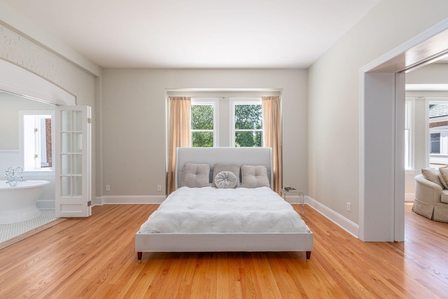 1750 Mount Beulah Ave, Southold, NY 11971 - bedroom featuring multiple windows and light wood-type flooring