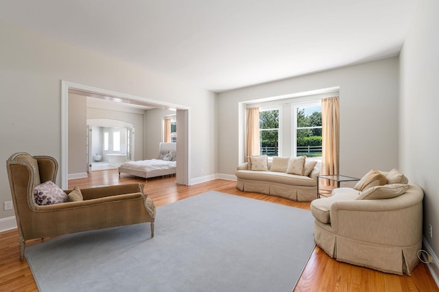 1750 Mount Beulah Ave, Southold, NY 11971 - living room featuring plenty of natural light, light wood-type flooring, and arched walkways
