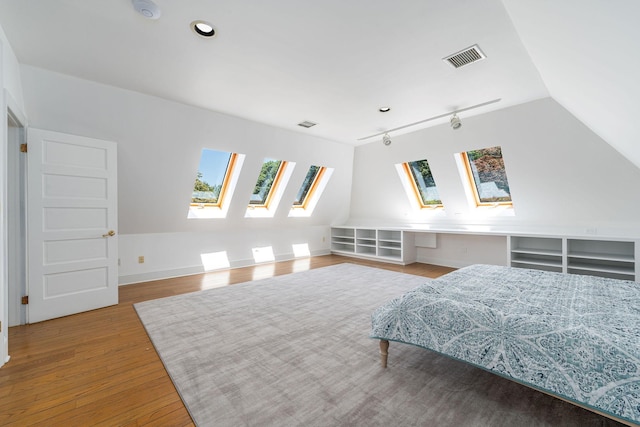 1750 Mount Beulah Ave, Southold, NY 11971 - bedroom with a skylight, wood finished floors, and lofted ceiling