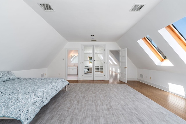 1750 Mount Beulah Ave, Southold, NY 11971 - bedroom featuring wood finished floors, lofted ceiling, and a skylight