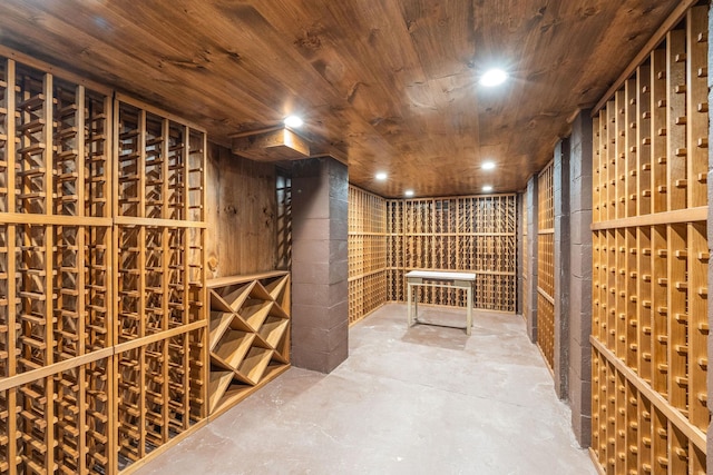 1750 Mount Beulah Ave, Southold, NY 11971 - wine cellar featuring unfinished concrete floors, wooden ceiling, and recessed lighting