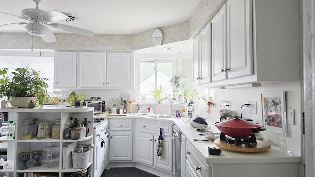 14436 32nd Ave, Flushing, NY 11354 - kitchen with a ceiling fan, white cabinets, and light countertops