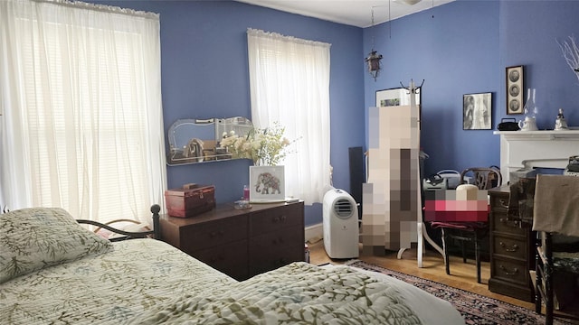 14436 32nd Ave, Flushing, NY 11354 - bedroom featuring wood finished floors and a fireplace