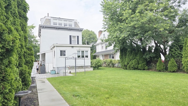 14436 32nd Ave, Flushing, NY 11354 - back of property featuring mansard roof and a lawn