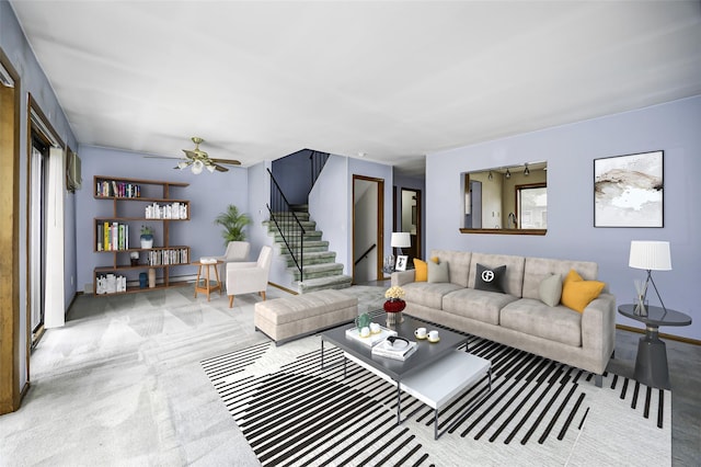 5306 Chelsea Cv N, Hopewell Junction, NY 12533 - carpeted living area featuring ceiling fan, stairs, and plenty of natural light