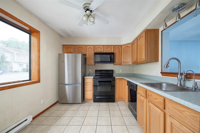 5306 Chelsea Cv N, Hopewell Junction, NY 12533 - kitchen featuring black appliances, a baseboard heating unit, light countertops, a ceiling fan, and light tile patterned floors