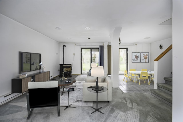5306 Chelsea Cv N, Hopewell Junction, NY 12533 - living room featuring a wood stove, stairway, and recessed lighting