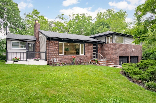 8 Junard Dr, Roslyn, NY 11576 - split level home featuring a chimney, a garage, brick siding, and a front yard