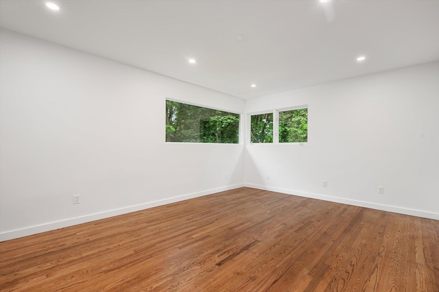 8 Junard Dr, Roslyn, NY 11576 - spare room featuring wood finished floors and recessed lighting