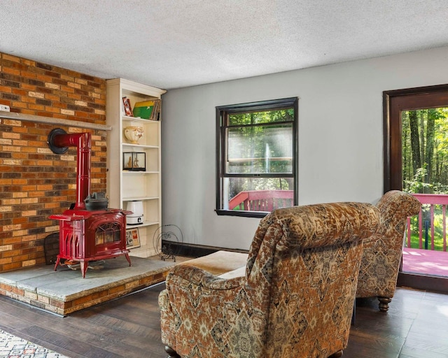 12 Summit Dr, Eldred, NY 12792 - sitting room featuring a wood stove and a textured ceiling