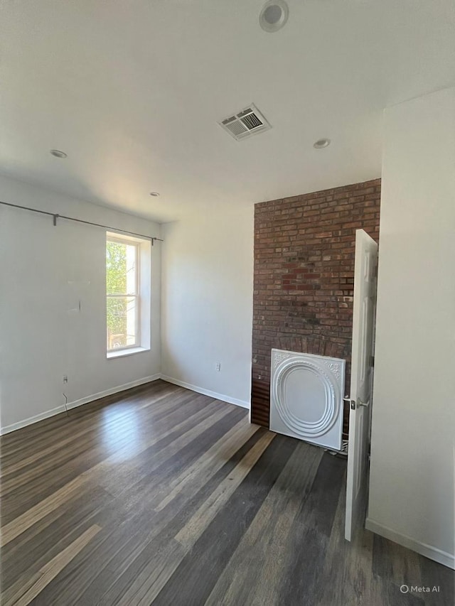 130 Van Dyke St, Brooklyn, NY 11231 - unfurnished room with dark wood-style flooring, baseboards, and a fireplace