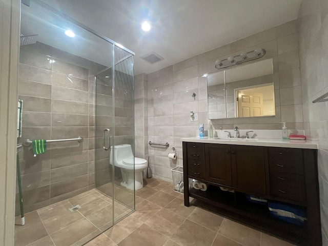 130 Van Dyke St, Brooklyn, NY 11231 - bathroom featuring tile walls, tile patterned floors, a shower stall, vanity, and toilet