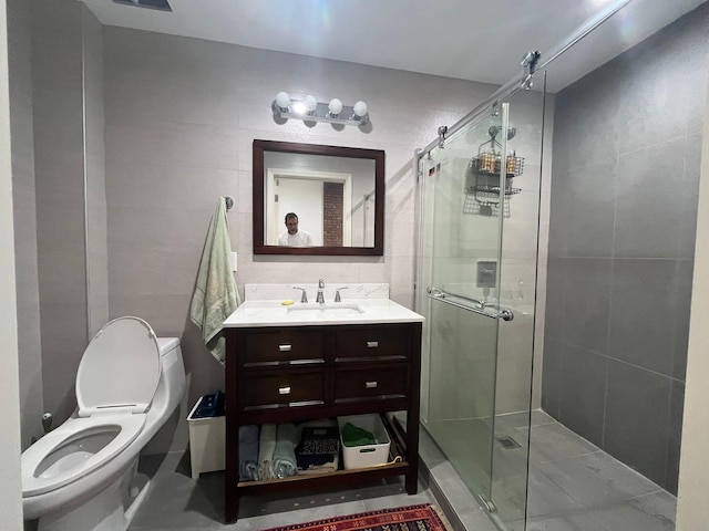 130 Van Dyke St, Brooklyn, NY 11231 - bathroom with a shower stall, vanity, toilet, and tile walls
