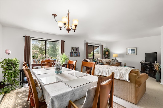 96 Molly Pitcher Ln Unit H, Yorktown Heights, NY 10598 - dining area featuring a chandelier, plenty of natural light, and light tile patterned flooring