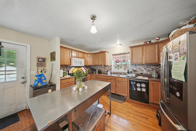 346 Stone School House Rd, Bloomingburg, NY 12721 - kitchen with dishwasher, stainless steel fridge, white microwave, tasteful backsplash, and light wood-type flooring
