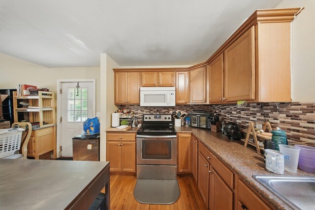 346 Stone School House Rd, Bloomingburg, NY 12721 - kitchen with white microwave, stainless steel range with electric cooktop, light wood-style floors, tasteful backsplash, and dark countertops