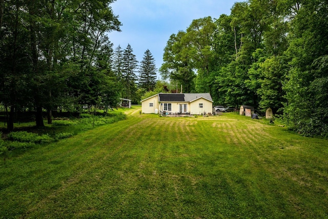 346 Stone School House Rd, Bloomingburg, NY 12721 - view of green lawn featuring a shed