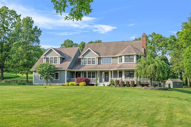 6 Long Meadow Way, Goshen, NY 10924 - view of front of property featuring a storage shed, a chimney, a porch, and a front lawn