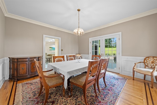 6 Long Meadow Way, Goshen, NY 10924 - dining room featuring crown molding, light wood finished floors, french doors, a wainscoted wall, and a chandelier