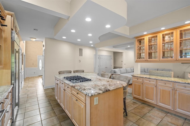 6 Long Meadow Way, Goshen, NY 10924 - kitchen featuring stainless steel gas stovetop, a kitchen breakfast bar, a center island, light tile patterned floors, and recessed lighting