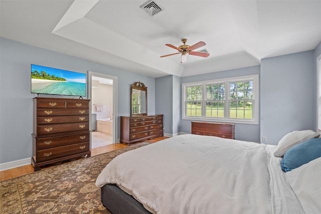6 Long Meadow Way, Goshen, NY 10924 - bedroom featuring a tray ceiling, wood finished floors, ceiling fan, and ensuite bathroom