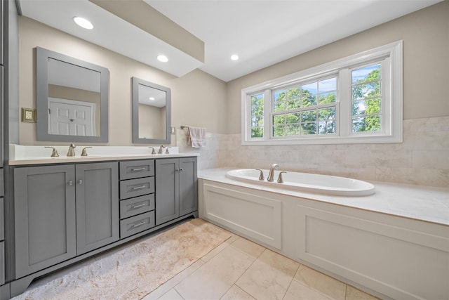 6 Long Meadow Way, Goshen, NY 10924 - bathroom featuring double vanity, a garden tub, tile patterned floors, and recessed lighting
