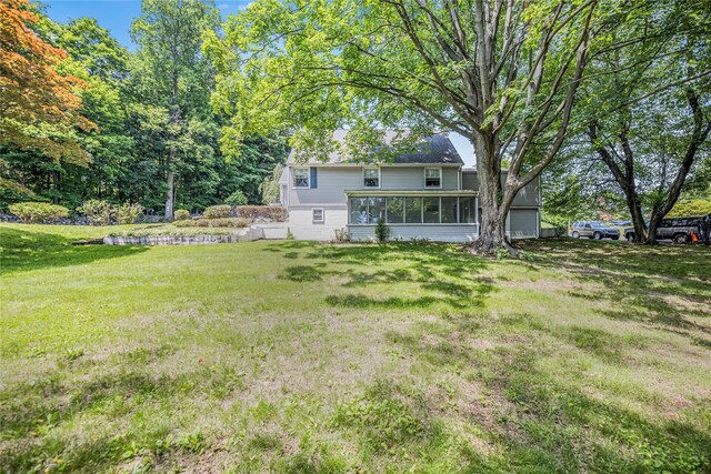 13 Valley View Dr, New Windsor, NY 12553 - view of green lawn with a sunroom