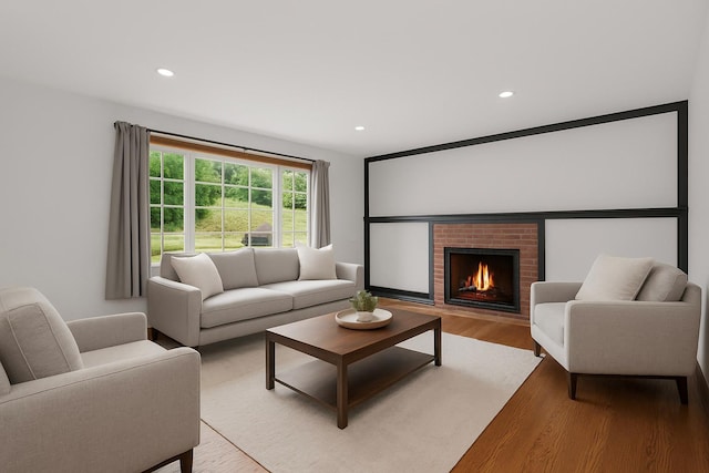 13 Valley View Dr, New Windsor, NY 12553 - living area with light wood-type flooring, a brick fireplace, and recessed lighting
