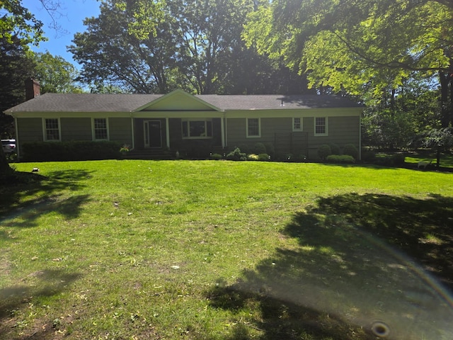 659 Horse Race Ln, Nissequogue, NY 11780 - view of front facade featuring a chimney and a front lawn