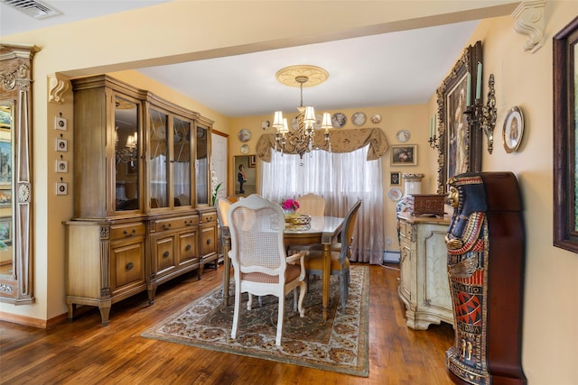 12 Roosevelt Pl, Massapequa, NY 11758 - dining area featuring a chandelier, dark wood-type flooring, a baseboard radiator, and baseboards