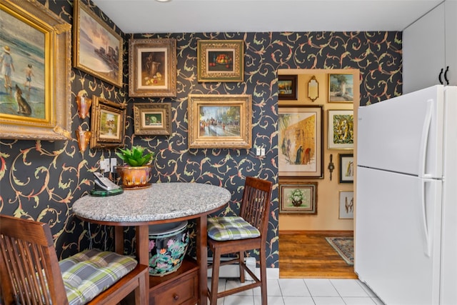12 Roosevelt Pl, Massapequa, NY 11758 - dining room featuring wallpapered walls and light tile patterned floors