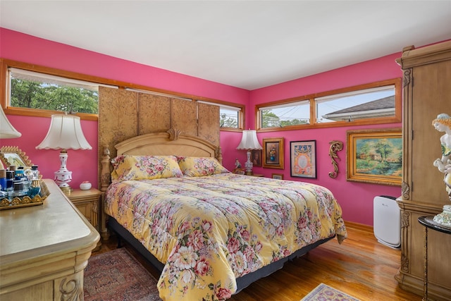 12 Roosevelt Pl, Massapequa, NY 11758 - bedroom with wood finished floors and baseboards