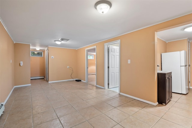 12 Roosevelt Pl, Massapequa, NY 11758 - empty room with ornamental molding, light tile patterned flooring, a baseboard heating unit, baseboard heating, and baseboards