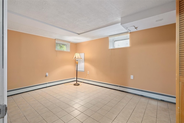 12 Roosevelt Pl, Massapequa, NY 11758 - below grade area with a textured ceiling, plenty of natural light, baseboards, and baseboard heating