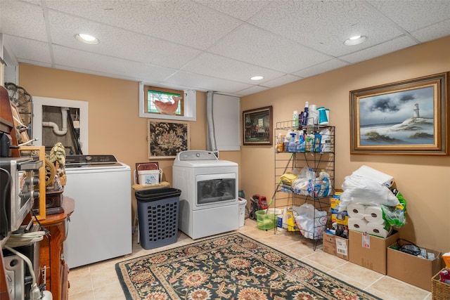 12 Roosevelt Pl, Massapequa, NY 11758 - laundry room with washer and clothes dryer, light tile patterned floors, and recessed lighting